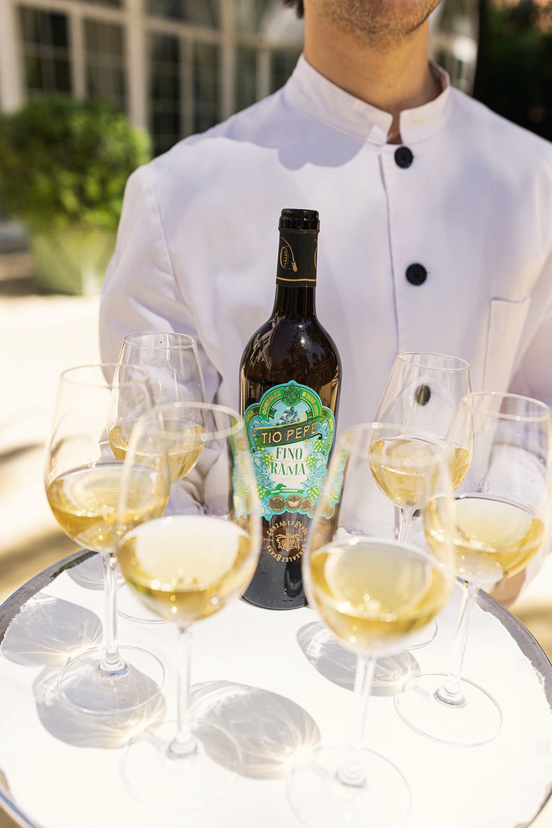 Waiter serving wine at the table