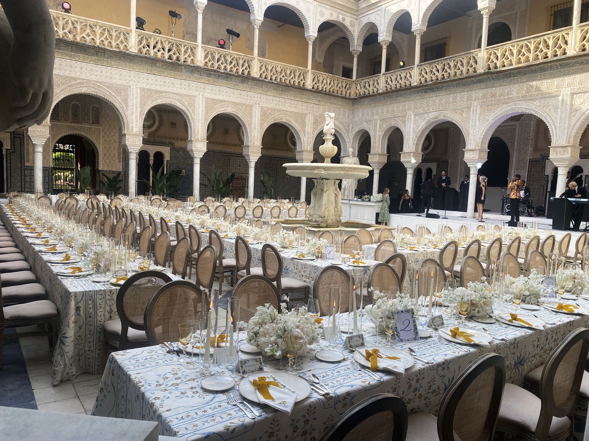 Arcaded courtyard set for a banquet