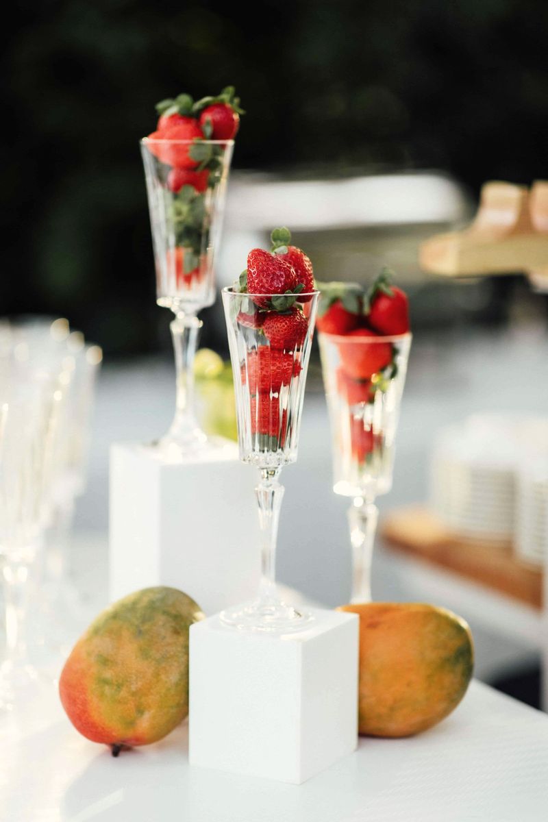 Glasses of strawberries on pedestals